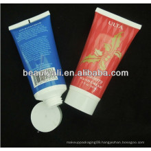 labeling round cosmetic tube with plastic cap